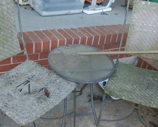 Two vintage wrought iron chairs and table