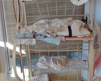 Heavy baker's rack full of vintage Linens