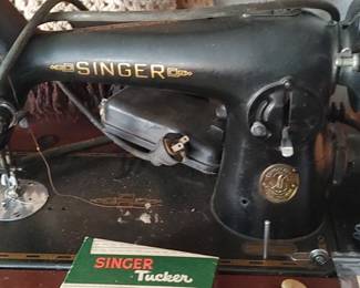 Located the first room to the right at the top of stairs vintage Singer sewing machine