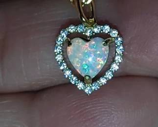 Beautiful open heart surrounded by sparklings zircons all handsets stones 14 karat gold over sterling silver necklace