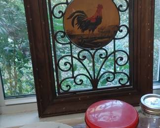 Heavy accent piece with scrolled cast iron and rooster in the middle