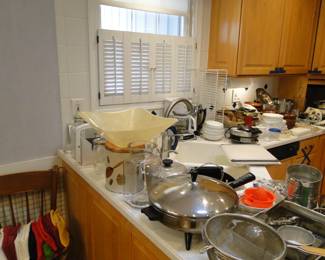 Vintage all over the place in the kitchen, that skillet is in working condition, pie plates, colanders, and sieves too