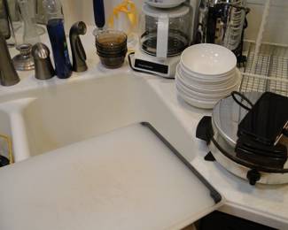 Cutting boards, and coffee maker, and a percolator, and a waffle maker, and some very nice, vintage Corelle dishes