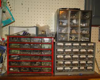 Assorted nuts and bolts holders, small drawers filled with items