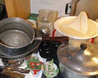 Vintage cookware, and tea bag holders, and plastic things, and a Tupperware Jello Mold too
