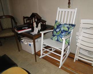 Rocking chair, and folding table and folding chair to the right