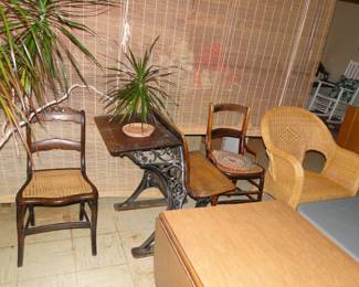 Wooden chairs, student desk, wicker chair, and yes, thanks for asking that rolling wooden divider is also for sale in the basement too