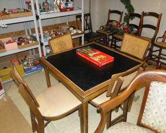 This is one amazing Mid Century Modern card table with four matching chairs