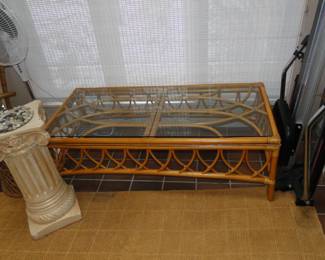 Rattan coffee table with glass top, and we have the matching sofa in the garage