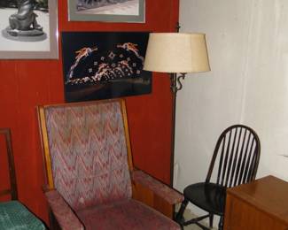 Chairs and artwork and floor lamp