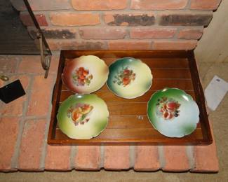 Beautiful decorative plates, and a very nice wooden serving table, which is about table size. You can use it for dessert charkootery