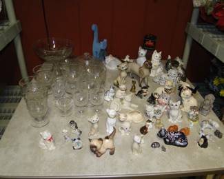 Lots of great vintage cat figurines. Cat figurines are all over the house