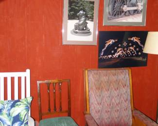 What does a framed pig, a locomotive wheel, and Native American art all have in common? Answer: The red wall they are hanging on