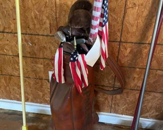 Golf bag with Ben Hogan golf clubs, flags, and brooms