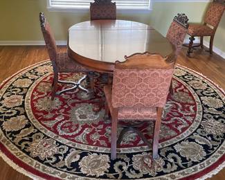Dining table with 6 upholstered chairs; area rugs