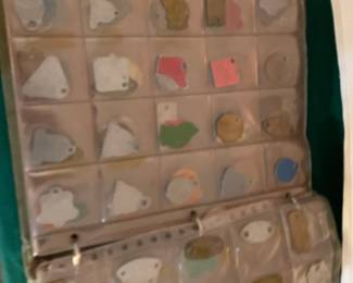 A Photo album  full of DOG  Tags