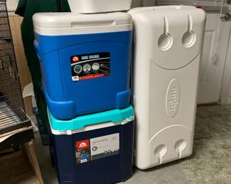  2 coolers with wheels & 1 extra Lg. cooler