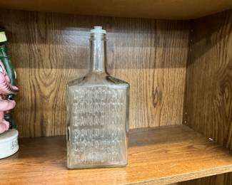 Canadian Whiskey Embossed Glass Bottle 