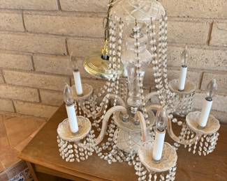 Elegant Crystal Chandelier
A stunning chandelier adorned with crystal beads and delicate candle-style lights, bringing timeless elegance and sophistication to any space.