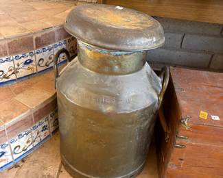 Vintage Metal Milk Can
A weathered vintage metal milk can with a rustic patina, ideal for farmhouse-style décor or as a unique planter.
