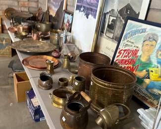 Assorted Vintage Copper and Brass Items
A collection of copper and brass pots, kettles, and decorative items, along with framed artwork. Ideal for vintage décor enthusiasts or collectors.