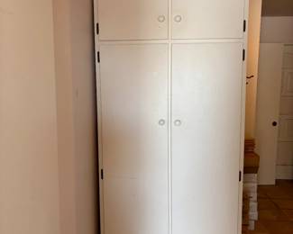 Tall White Storage Cabinet:
A spacious, multi-compartment white storage cabinet. Ideal for organizing a home office, craft room, or kitchen pantry.