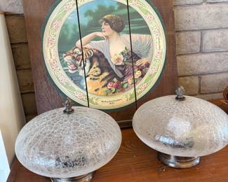 Savannah Brewing Co. Vintage Advertisement and Crackled Glass Shades
A vintage Savannah Brewing Co. advertisement featuring a classic design and two crackled glass light shades with silver bases, perfect for lighting and vintage enthusiasts.