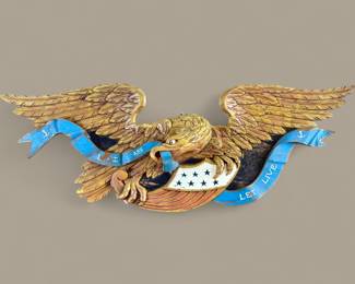 Large carved, gilded and painted wood American Federal Eagle clutching a red, white and blue Liberty Shield and a blue "Live and Let Live" Banner.  Made by the Artistic Carving Company of Boston c. 1950-60.  Some pieces in need of repair.