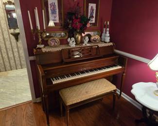 The piano of course comes with a bench and it's neutral color palette assures that it will work with any other decor.