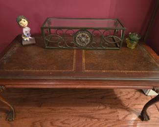 Beautifully inlaid, this formal coffee table is sure to be a great addition to any space.
