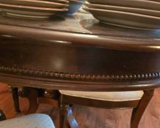 The details on the table and chairs are stunning. They don't make this quality of furniture any more, not without it costing a pretty penny! Think of the tales this table could tell if it could talk!