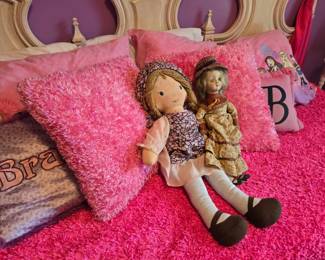 They seem to like the pink Bratz bed!