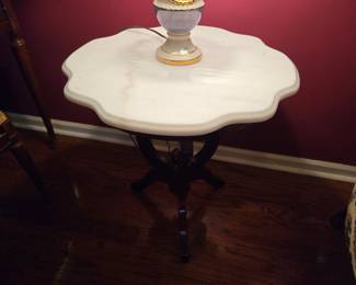 There are a pair of these beautiful marble topped tables that can be used in so many different ways.