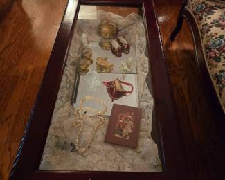 This shadow box coffee table is just the place to share and keep safe family heirlooms.