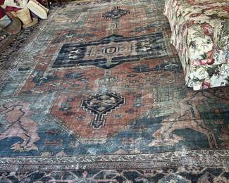 Large Oriental rug with lots of wear