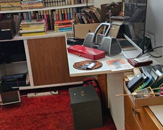 To the right is a desk, 3 drop downs on each side