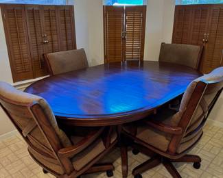 Wooden Dining table with 4 rolling chairs