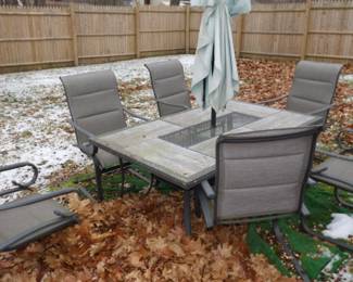 Stone Table With Six Dining Chairs and Umbrella