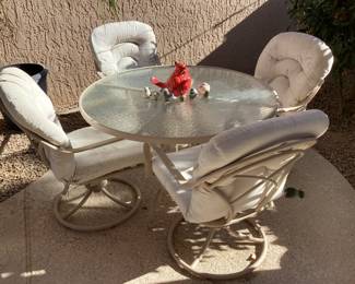 Nice patio table with four swivel chairs
