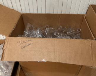 Hundreds of plastic juice containers with lids, multiple sizes, perfect for small business