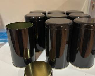 Dozens of tea canisters for resale