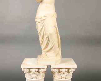 Carved marble classical sculpture and two corinthian columns