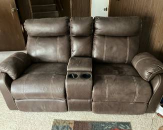 Reclining loveseat with middle console