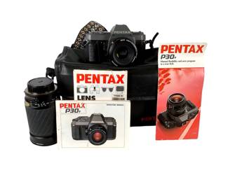 TEWA214 Pentax P30T 35mm Camera With Extra Lens Comes with a ProMaster Spectrum 7 auto zoom f=28 200mm. Has original manual and camera carrying case. Has a shoulder strap as well.
