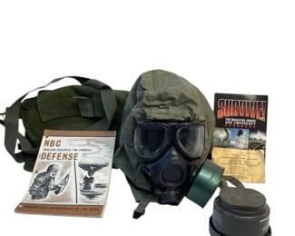 TEWA711 Chemical, Biological Defense Kit Lot includes gas mask with filtering canister, a backpack and 2 books on surviving an emergency.
