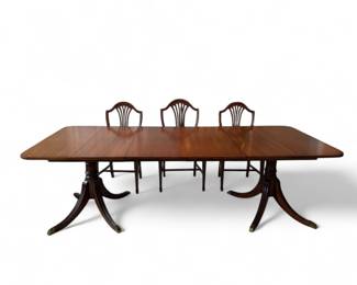 Duncan Phyfe Dining table with two leaves and table pad and 6 Duncan Phyfe Shield Chairs (2 with arms)