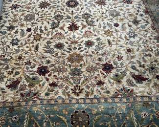 8'x10' hand knotted area rug. 