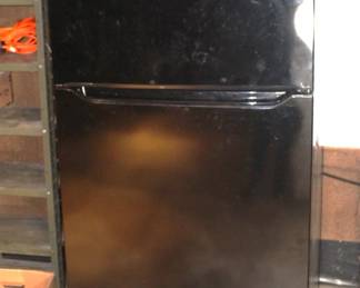 Black Frigidaire Refrigerator w/top freezer.