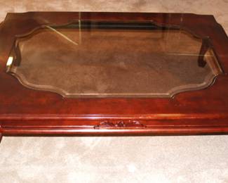 Glass top coffee table. 54" L x 40" W x 15 1/2" H.