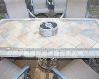 Patio table with eight swivel arm chairs w/umbrella stand.